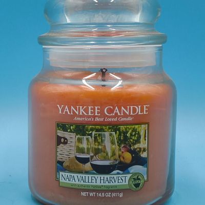 Lot of approximately 11 Yankee Candle glass jar candles — assorted scents & sizes
