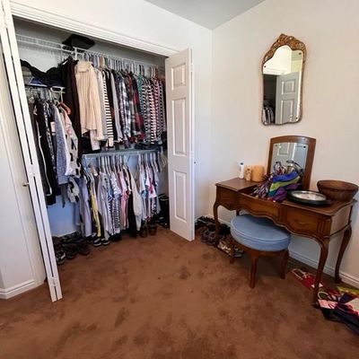 Sale Photo Thumbnail #33: vanity table. mirror, blue stool, clothing.