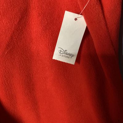 Sale Photo Thumbnail #7: NWT (New with tags) red fleece quarter-zip pullover from The Disney Store, featuring embroidered Minnie Mouse patch on the left chest and embroidered 'Nina' name detail on the right chest. 100% polyester fleece construction. Brand tags attached. Size: Lad