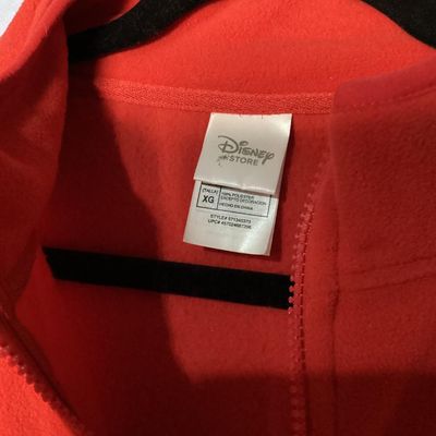 Sale Photo Thumbnail #6: NWT (New with tags) red fleece quarter-zip pullover from The Disney Store, featuring embroidered Minnie Mouse patch on the left chest and embroidered 'Nina' name detail on the right chest. 100% polyester fleece construction. Brand tags attached. Size: Lad