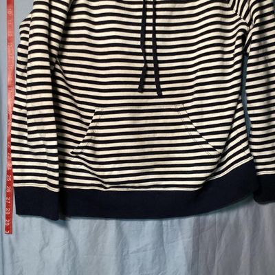 Sale Photo Thumbnail #18: Liz Claiborne navy blue and white horizontal striped long-sleeve sweatshirt with a front kangaroo pocket and drawstring collar. Size 1X. Measures approximately 27 inches in length. In good pre-owned condition with no visible stains or tears.