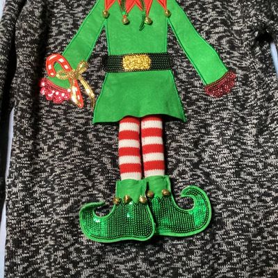 Sale Photo Thumbnail #24: United States Sweaters Holiday brand ugly Christmas sweater tunic with an elf body design featuring sequins, jingle bells, and 3D applique details. New with tags from Kohl's (MSRP $50.00). 

- Brand: United States Sweaters Holiday
- Size: XL
- Color: Blac