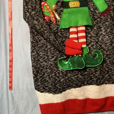 Sale Photo Thumbnail #25: United States Sweaters Holiday brand ugly Christmas sweater tunic with an elf body design featuring sequins, jingle bells, and 3D applique details. New with tags from Kohl's (MSRP $50.00). 

- Brand: United States Sweaters Holiday
- Size: XL
- Color: Blac