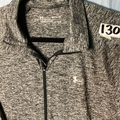 Sale Photo Thumbnail #32: Men's Under Armour HeatGear 1/4 zip long sleeve pullover shirt in heathered gray. Features a loose fit style and logo accents on the front chest and upper back. Size XL / TG / EG. Measures approximately 28.5 inches long. Appears in good pre-owned conditio