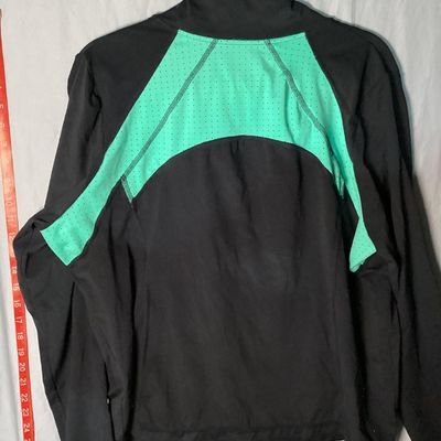 Sale Photo Thumbnail #37: Xersion brand Quick-Dri full-zip athletic jacket in black with teal/mint green perforated accent panels. Features front zip pockets and high collar. Made of 87% polyester and 13% spandex. Appears lightly used with no major flaws noted. Tag size 0X.