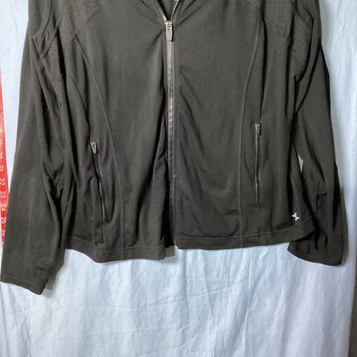 Sale Photo Thumbnail #45: Xersion brand women's black full-zip activewear jacket in size 0X. Features Quick-Dri moisture-wicking fabric, ventilated perforated panels across the upper chest and back, and front zipper pockets. Made of 88% polyester and 12% spandex. Appears lightly u