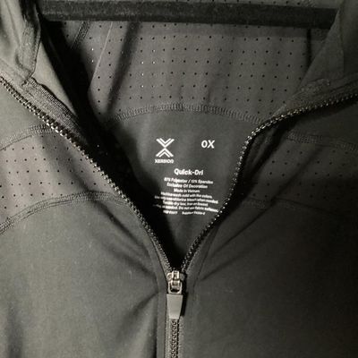 Sale Photo Thumbnail #44: Xersion brand women's black full-zip activewear jacket in size 0X. Features Quick-Dri moisture-wicking fabric, ventilated perforated panels across the upper chest and back, and front zipper pockets. Made of 88% polyester and 12% spandex. Appears lightly u