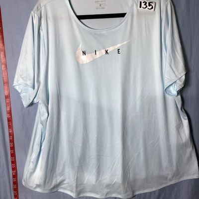 Sale Photo Thumbnail #53: Women's Nike Running Dri-Fit short sleeve t-shirt in light blue with front Nike graphic. Size 1X. Made in Cambodia. Pre-owned condition with minor wear to the graphic transfer.
