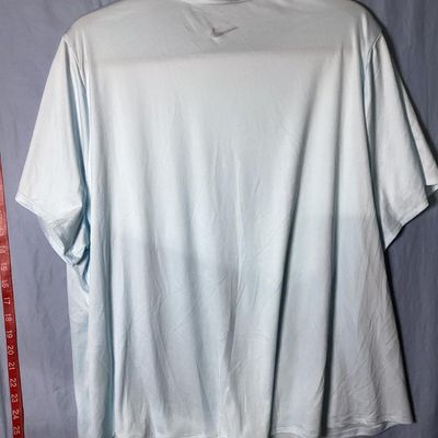 Sale Photo Thumbnail #56: Women's Nike Running Dri-Fit short sleeve t-shirt in light blue with front Nike graphic. Size 1X. Made in Cambodia. Pre-owned condition with minor wear to the graphic transfer.