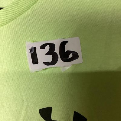 Sale Photo Thumbnail #58: Under Armour men's short sleeve T-shirt in neon green / lime yellow. Loose fit style, size XXL . Features black Under Armour logo printed on the left chest and back upper neck. Lightly used condition with light wrinkling, no obvious tears or major stains 