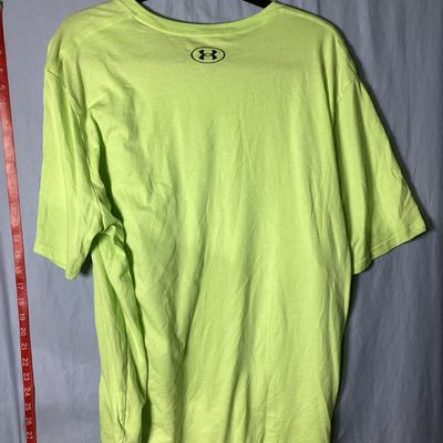 Sale Photo Thumbnail #60: Under Armour men's short sleeve T-shirt in neon green / lime yellow. Loose fit style, size XXL . Features black Under Armour logo printed on the left chest and back upper neck. Lightly used condition with light wrinkling, no obvious tears or major stains 