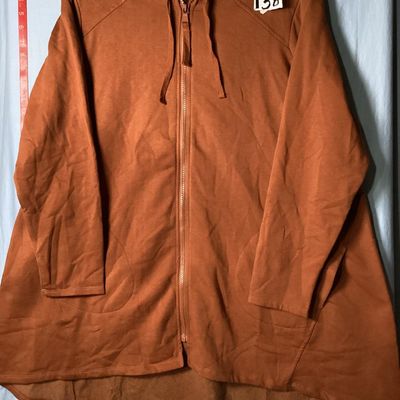 Sale Photo Thumbnail #65: LOGO Lounge by Lori Goldstein longline zip-up hoodie in a rust/terracotta shade. Features a hooded neckline with drawstring, front zip closure, front patch pockets, long sleeves, and a high-low hem. Lightly used condition with no visible damage or severe 