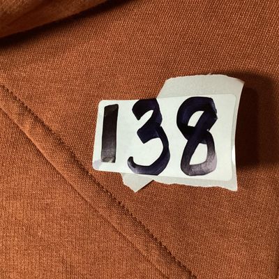 Sale Photo Thumbnail #66: LOGO Lounge by Lori Goldstein longline zip-up hoodie in a rust/terracotta shade. Features a hooded neckline with drawstring, front zip closure, front patch pockets, long sleeves, and a high-low hem. Lightly used condition with no visible damage or severe 