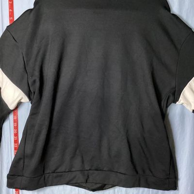 Sale Photo Thumbnail #77: Black Nike crewneck sweatshirt with embroidered center swoosh and white and grey color-blocked stripes on the sleeves. Tagged size XL made in Vietnam. Appears lightly used with no major flaws or visible damage.