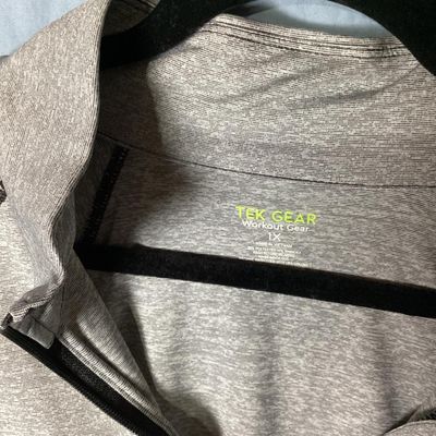 Sale Photo Thumbnail #100: Women's full-zip athletic workout jacket by Tek Gear Workout Gear. Heathered gray performance fabric with dark contrast stitching, full front zipper, high collar, and side zippered hand pockets. Size 1X (90% polyester, 10% spandex). Appears to be in very 