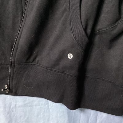 Sale Photo Thumbnail #107: Xersion brand women's black full-zip hooded jacket/sweatshirt, size XL (semi fit). Features front pockets, drawstring hood, and ribbed trim. Lightly used condition with minimal wear. Approx. 28-29 inches in length.