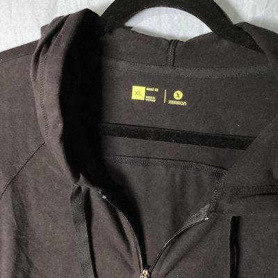 Sale Photo Thumbnail #105: Xersion brand women's black full-zip hooded jacket/sweatshirt, size XL (semi fit). Features front pockets, drawstring hood, and ribbed trim. Lightly used condition with minimal wear. Approx. 28-29 inches in length.