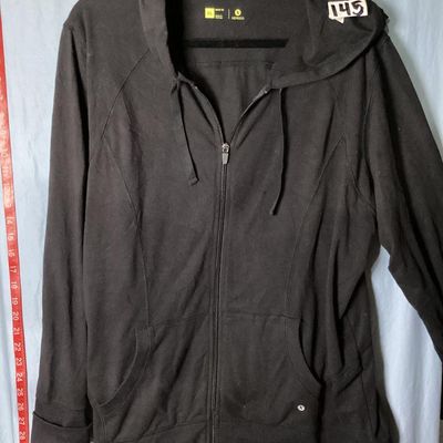 Sale Photo Thumbnail #104: Xersion brand women's black full-zip hooded jacket/sweatshirt, size XL (semi fit). Features front pockets, drawstring hood, and ribbed trim. Lightly used condition with minimal wear. Approx. 28-29 inches in length.