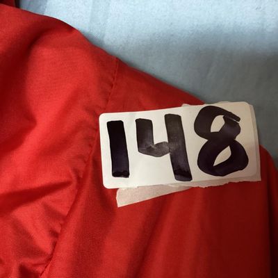 Sale Photo Thumbnail #124: Red and dark gray Columbia Sportswear Company hooded windbreaker/rain jacket. Features full zip front with snap closure overlay, mesh lining, hood with drawstring, and side pockets. Women's size XL, made in Philippines. Light wear visible, overall good pr