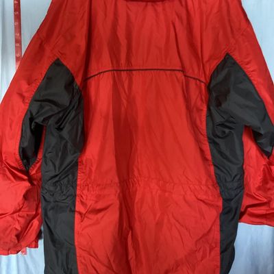 Sale Photo Thumbnail #128: Red and dark gray Columbia Sportswear Company hooded windbreaker/rain jacket. Features full zip front with snap closure overlay, mesh lining, hood with drawstring, and side pockets. Women's size XL, made in Philippines. Light wear visible, overall good pr