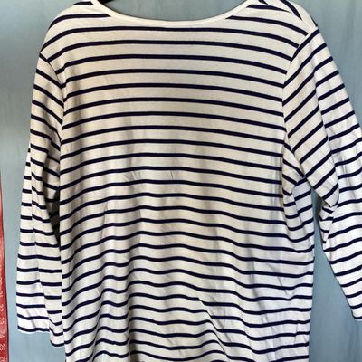 Sale Photo Thumbnail #134: Women's Quacker Factory by Jeanne Bice v-neck top featuring navy blue and white horizontal stripes with sequined American flag embellishments across the chest and shoulders. 3/4 length sleeves. Size XL. Made in China. In good pre-owned condition with no v
