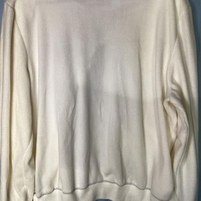 Sale Photo Thumbnail #151: An Alfred Dunner long-sleeve fleece sweatshirt in cream/white, featuring intricate floral embroidery, sequins, and bead accents along the front panel. Made from 100% polyester. Size XL. Appears to be in good pre-owned condition with minor signs of wear.
