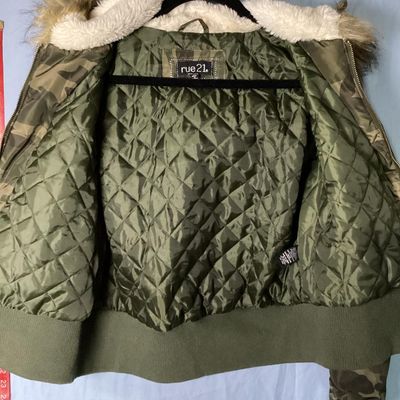 Sale Photo Thumbnail #157: Rue21 camouflage print bomber jacket featuring a faux fur trimmed, sherpa-lined hood, quilted inner lining, full zip front, and rib-knit waist trim and cuffs. Includes side pockets with snap closures and a zippered sleeve pocket. Size Large. Made in China