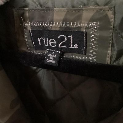 Sale Photo Thumbnail #155: Rue21 camouflage print bomber jacket featuring a faux fur trimmed, sherpa-lined hood, quilted inner lining, full zip front, and rib-knit waist trim and cuffs. Includes side pockets with snap closures and a zippered sleeve pocket. Size Large. Made in China