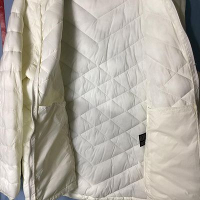 Sale Photo Thumbnail #163: White quilted hooded puffer jacket by ZeroXposur in size XXL/XXG. Features a full zip front, attached hood with drawstrings, side zip pockets, and interior slip pockets. Measures approximately 26 inches in length. In good pre-owned condition with no major