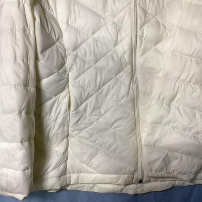 Sale Photo Thumbnail #161: White quilted hooded puffer jacket by ZeroXposur in size XXL/XXG. Features a full zip front, attached hood with drawstrings, side zip pockets, and interior slip pockets. Measures approximately 26 inches in length. In good pre-owned condition with no major