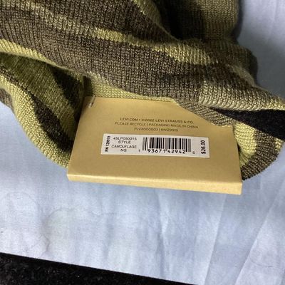 Sale Photo Thumbnail #165: New with tags Levi's knit beanie hat featuring a green camo pattern with a faux leather Levi's logo patch on the front cuff. Tag shows style 45LP050015, color Camouflage,  One Size.Material is knit fabric. New condition with original retail tag attached.