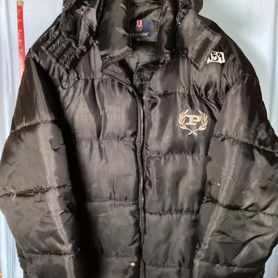 Sale Photo Thumbnail #190: Men's Phat Farm Classics hooded puffer jacket in black, size XL. Features a full zip front, detachable or adjustable hood, embroidered logo crest on the left chest, and subtle logo pattern printed across the shell fabric. Condition shows light wear, inclu