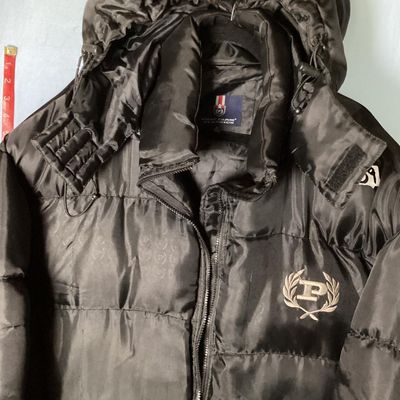 Sale Photo Thumbnail #193: Men's Phat Farm Classics hooded puffer jacket in black, size XL. Features a full zip front, detachable or adjustable hood, embroidered logo crest on the left chest, and subtle logo pattern printed across the shell fabric. Condition shows light wear, inclu