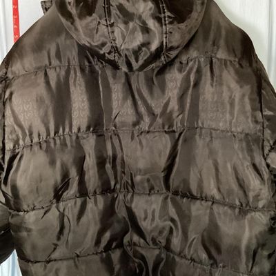 Sale Photo Thumbnail #197: Men's Phat Farm Classics hooded puffer jacket in black, size XL. Features a full zip front, detachable or adjustable hood, embroidered logo crest on the left chest, and subtle logo pattern printed across the shell fabric. Condition shows light wear, inclu