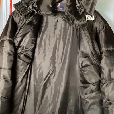 Sale Photo Thumbnail #194: Men's Phat Farm Classics hooded puffer jacket in black, size XL. Features a full zip front, detachable or adjustable hood, embroidered logo crest on the left chest, and subtle logo pattern printed across the shell fabric. Condition shows light wear, inclu