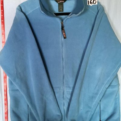 Sale Photo Thumbnail #199: L.L. Bean women's full-zip fleece jacket in light blue. Features front zippered pockets, high collar, interior cinch waist adjustment, and branded zipper pull. 

- Brand: L.L. Bean
- Size: Women's XL - Regular
- Material: 100% Polyester
- Color: Light Blu