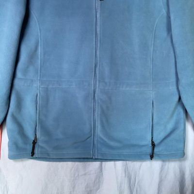 Sale Photo Thumbnail #202: L.L. Bean women's full-zip fleece jacket in light blue. Features front zippered pockets, high collar, interior cinch waist adjustment, and branded zipper pull. 

- Brand: L.L. Bean
- Size: Women's XL - Regular
- Material: 100% Polyester
- Color: Light Blu