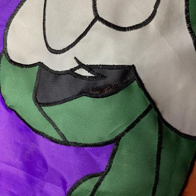 Sale Photo Thumbnail #214: Large vintage fabric/nylon decorative Halloween door or wall banner featuring Disney's Goofy dressed as Frankenstein's monster under a full moon. Fabric appliqué construction with embroidered black outline stitching. Measures approximately 75 inches long
