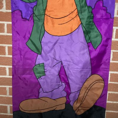 Sale Photo Thumbnail #212: Large vintage fabric/nylon decorative Halloween door or wall banner featuring Disney's Goofy dressed as Frankenstein's monster under a full moon. Fabric appliqué construction with embroidered black outline stitching. Measures approximately 75 inches long