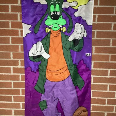 Sale Photo Thumbnail #210: Large vintage fabric/nylon decorative Halloween door or wall banner featuring Disney's Goofy dressed as Frankenstein's monster under a full moon. Fabric appliqué construction with embroidered black outline stitching. Measures approximately 75 inches long