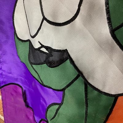 Sale Photo Thumbnail #213: Large vintage fabric/nylon decorative Halloween door or wall banner featuring Disney's Goofy dressed as Frankenstein's monster under a full moon. Fabric appliqué construction with embroidered black outline stitching. Measures approximately 75 inches long
