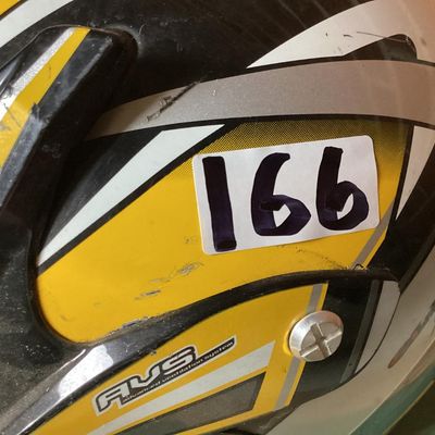 Sale Photo Thumbnail #237: HJC CL-X4 Fuel off-road/motocross motorcycle helmet in yellow, silver, black, and white graphics. Marked as Adult Large size with Advanced Ventilation System (AVS). Inner label indicates manufacturing date of September 2001. Features visor, chin guard ven
