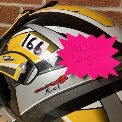 Sale Photo Thumbnail #242: HJC CL-X4 Fuel off-road/motocross motorcycle helmet in yellow, silver, black, and white graphics. Marked as Adult Large size with Advanced Ventilation System (AVS). Inner label indicates manufacturing date of September 2001. Features visor, chin guard ven