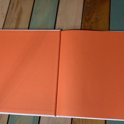 Sale Photo Thumbnail #260: Hardcover Peanuts picture book titled 'Kick the Football, Charlie Brown!' by Charles M. Schulz. Features full-color illustrations featuring Charlie Brown and Lucy. Clean interior pages with bright orange endpapers. Overall in good condition with minimal w