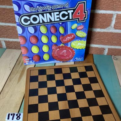 Sale Photo Thumbnail #297: Lot includes a classic Connect 4 board game by Hasbro Gaming, brand new in its original factory shrink wrap, and a wooden checkerboard/chessboard by Cardinal Industries. Both items are in clean condition; Connect 4 is unopened.