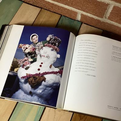 Sale Photo Thumbnail #307: Hardcover photography book titled 'In Focus: National Geographic Greatest Portraits'. Features 280 portrait photographs spanning over a century. Includes original dust jacket. Dust jacket shows some wear and a tear on the back corner, but internal pages r