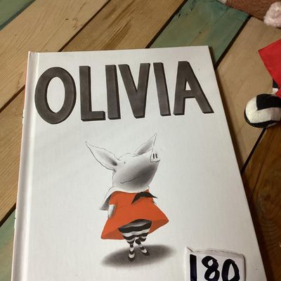 Sale Photo Thumbnail #311: Pairing of an 'Olivia' hardcover children's book by Ian Falconer alongside a matching 2001 Gund plush doll made exclusively for FAO Schwarz. Plush includes original hangtags and sewn-in tags. Both items are in good pre-owned condition with light wear.
