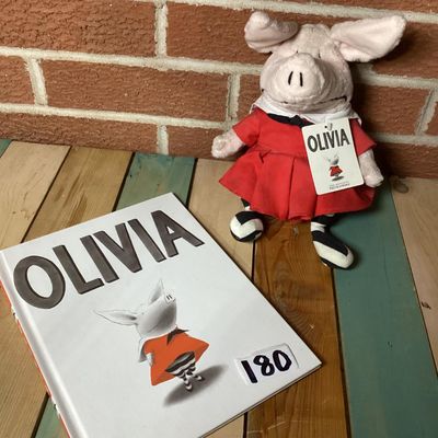 Sale Photo Thumbnail #309: Pairing of an 'Olivia' hardcover children's book by Ian Falconer alongside a matching 2001 Gund plush doll made exclusively for FAO Schwarz. Plush includes original hangtags and sewn-in tags. Both items are in good pre-owned condition with light wear.