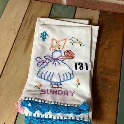 Sale Photo Thumbnail #317: Set of vintage white cotton kitchen/tea towels featuring cross-stitched embroidered designs for days of the week (Sunday through Saturday). Each towel depicts a Sunbonnet Sue/chores motif with colorful crocheted lace trim at the bottom hem. Appears to be 