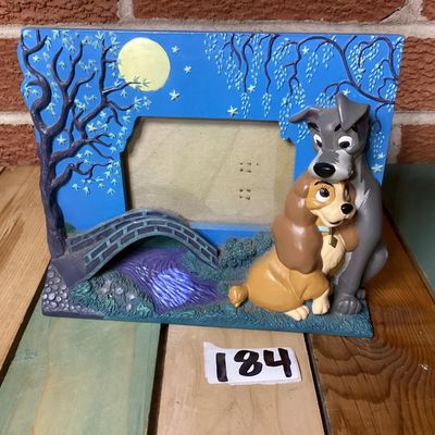 Sale Photo Thumbnail #343: 3D resin picture frame featuring Disney's Lady and the Tramp under a full moon scene with a bridge. Designed for tabletop display with an easel back stand. Shows minor wear and faint marks on the back, but overall in good condition with vibrant colors and